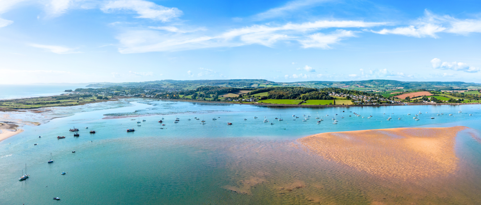 Aerial view of Dawlish Warren in Devon with rolling moors in the background
